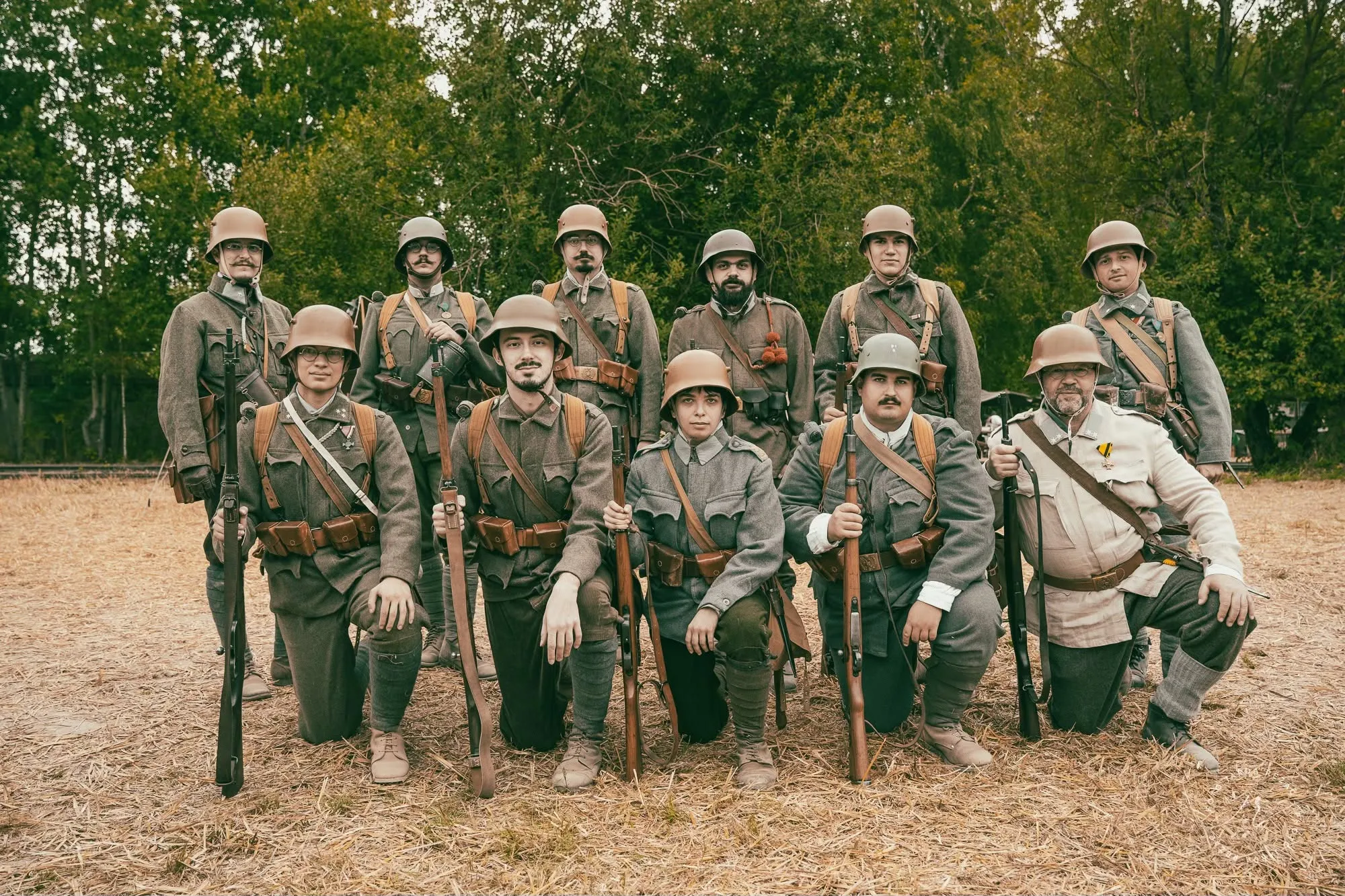 Members of the reenactment group posing together in historical military uniforms.